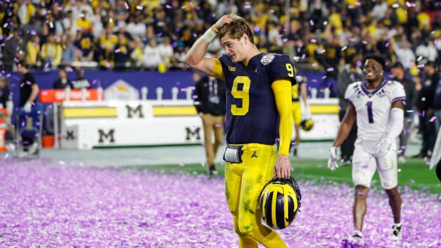 Michigan quarterback J.J. McCarthy (9) walks off the field after the Wolverines lost 51-45 to TCU at the Fiesta Bowl at State Farm Stadium in Glendale, Ariz. on Saturday, Dec. 31, 2022.